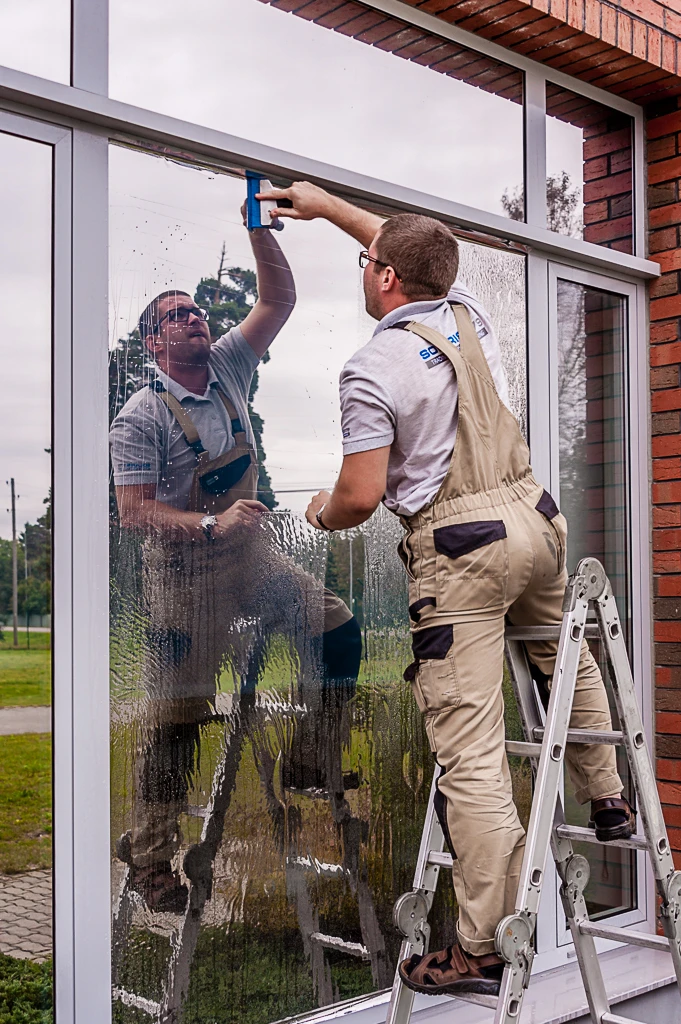 Glass window privacy film in silver on a building facade