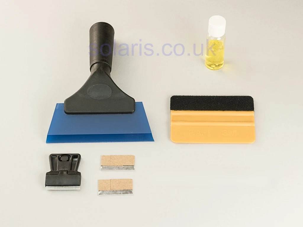 Window film installation tool kit with squeegees and blades